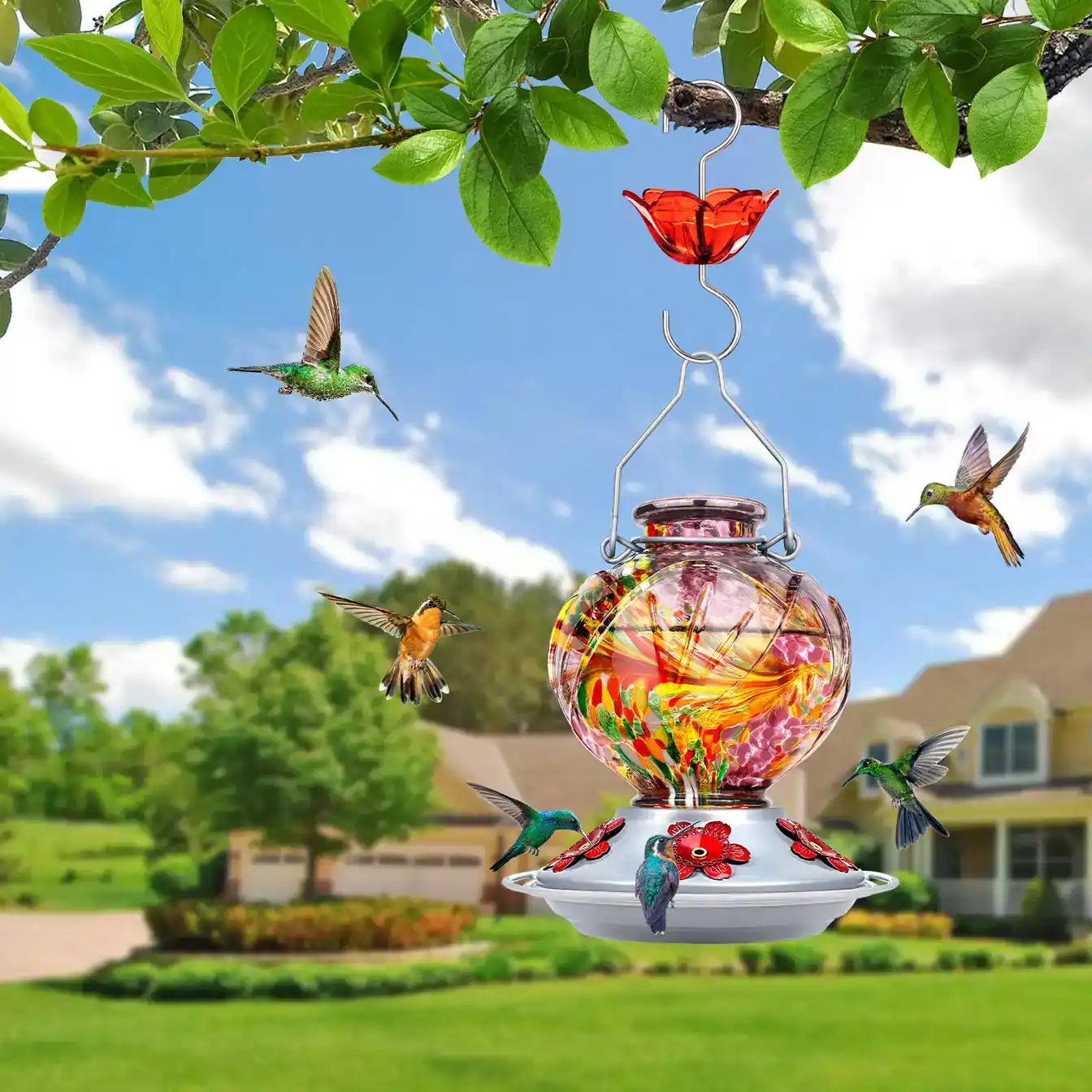 Bolite glass hummingbird feeder in a colorful garden